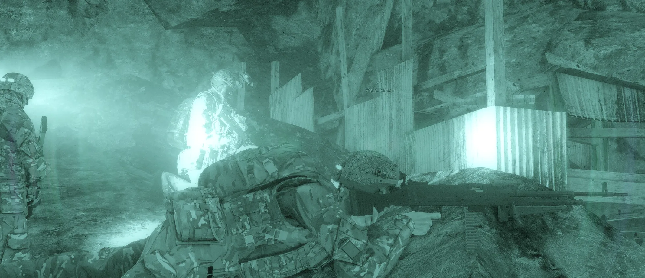 Night-vision image of a fighting position with a machine gunner in a sangar-style emplacement.